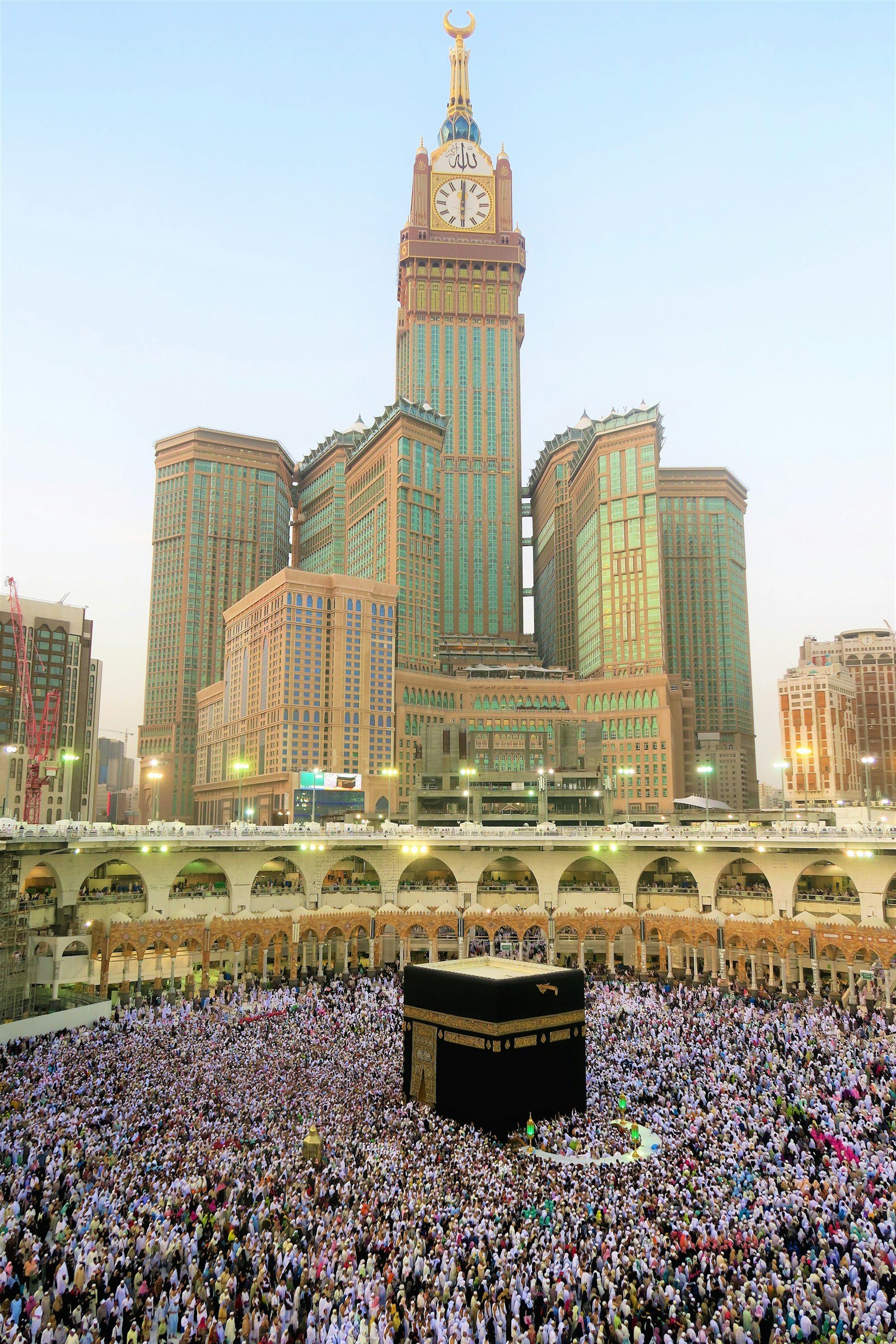 The Golden Door of the Holy Kaaba and pilgrims in heartfelt prayer at Multazam